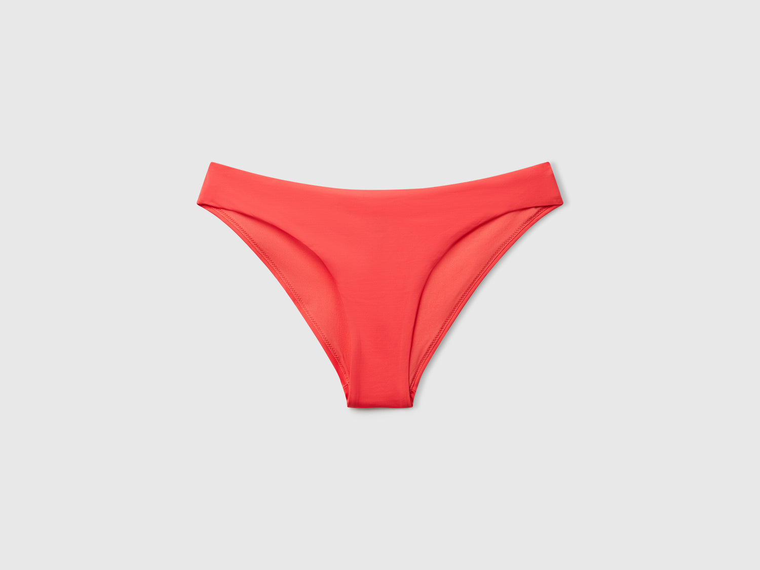 Slip costume basico in ECONYL® da donna corallo | Benetton Outlet
