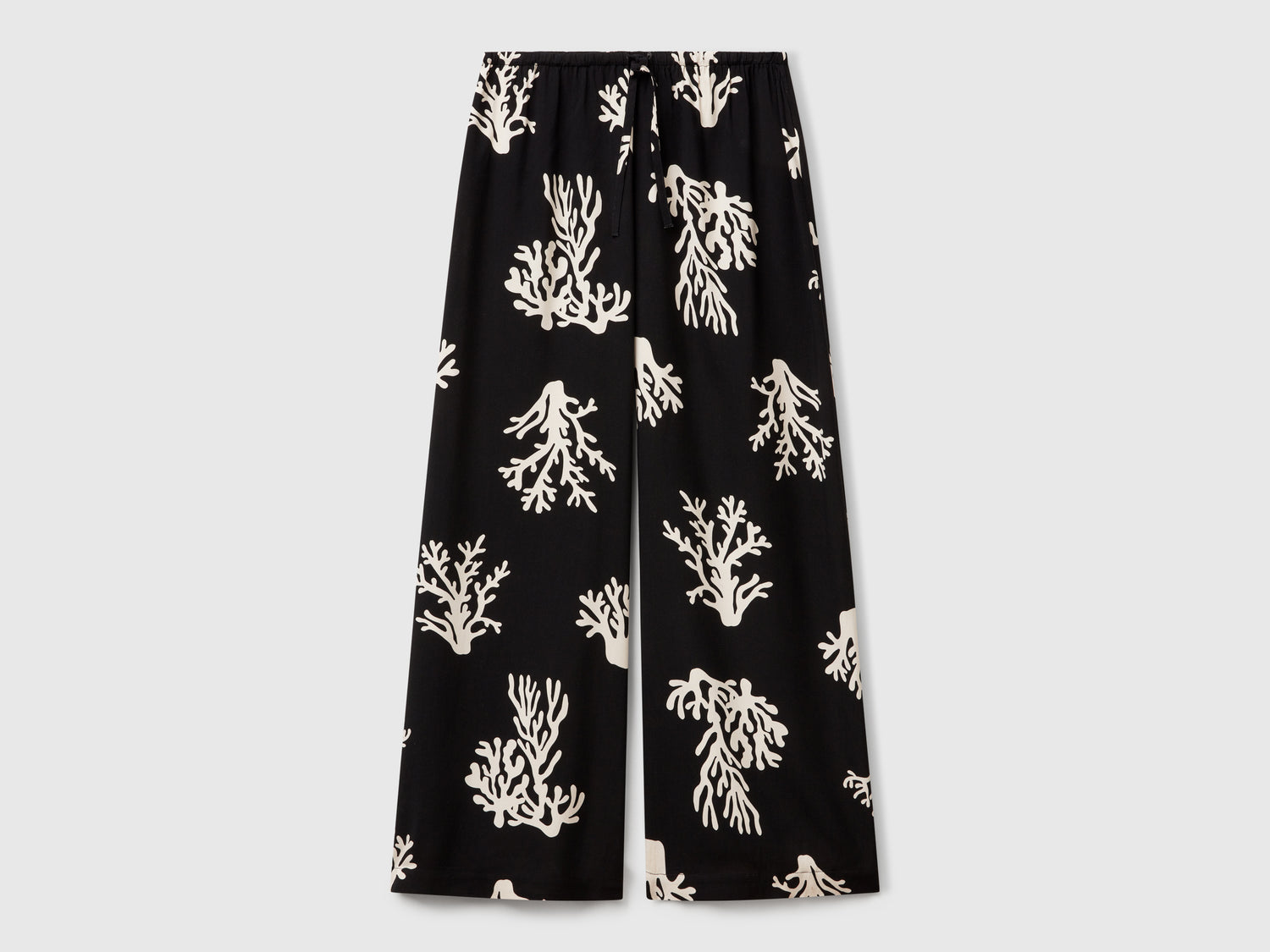 Pantaloni con stampa coralli da donna nero | Benetton Outlet