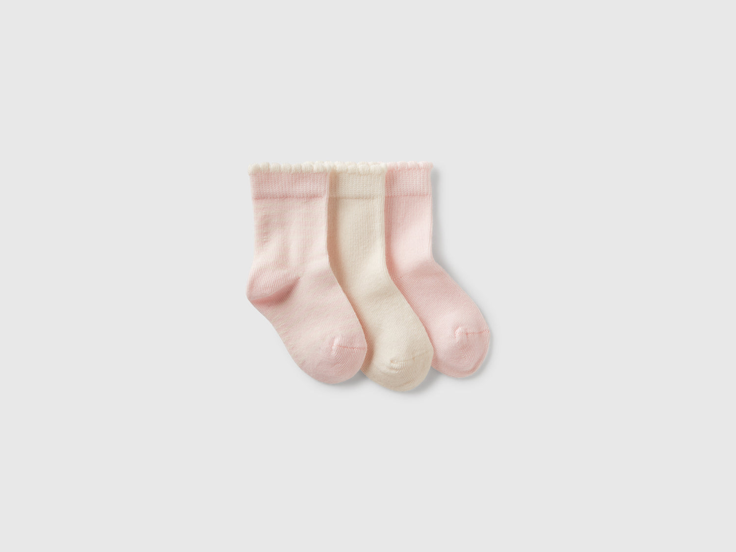 Tre paia di calzini e panna da neonato rosa | Benetton Outlet
