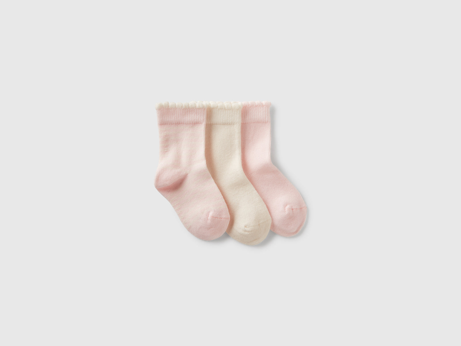 Tre paia di calzini e panna da neonato rosa | Benetton Outlet