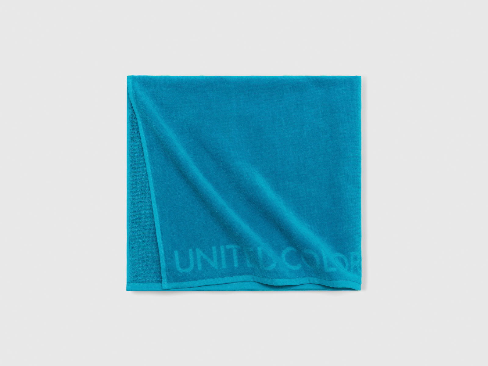 Telo mare jacquard da uomo turchese 3 | Benetton Outlet