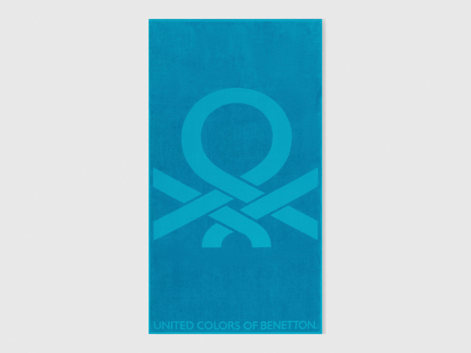 Telo mare jacquard da uomo turchese | Benetton Outlet