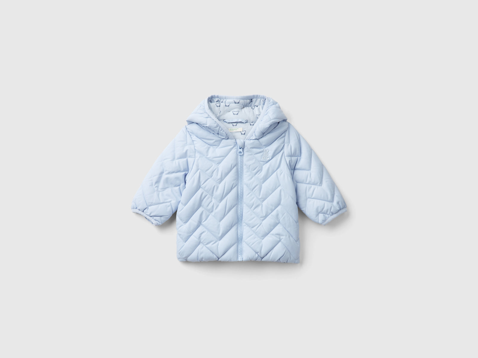Piumino imbottito con orecchie da neonato celeste | Benetton Outlet