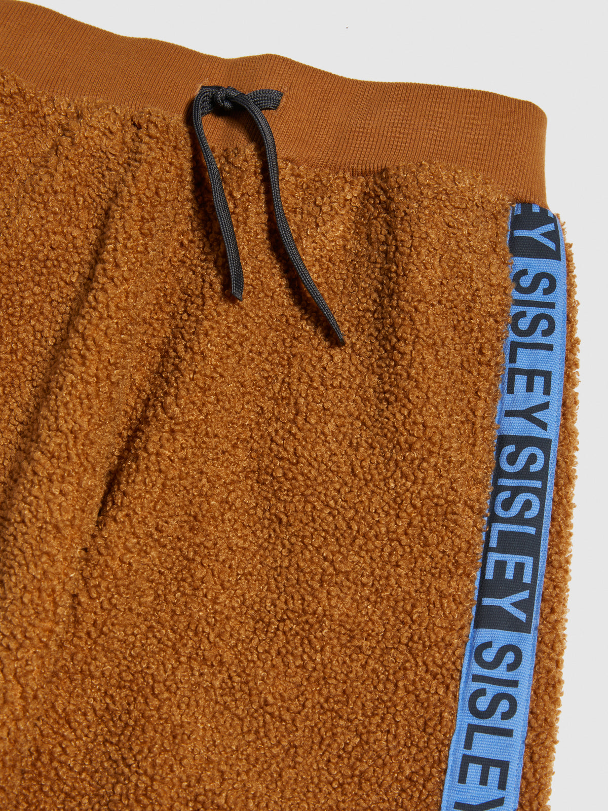 Joggers teddy con banda logata