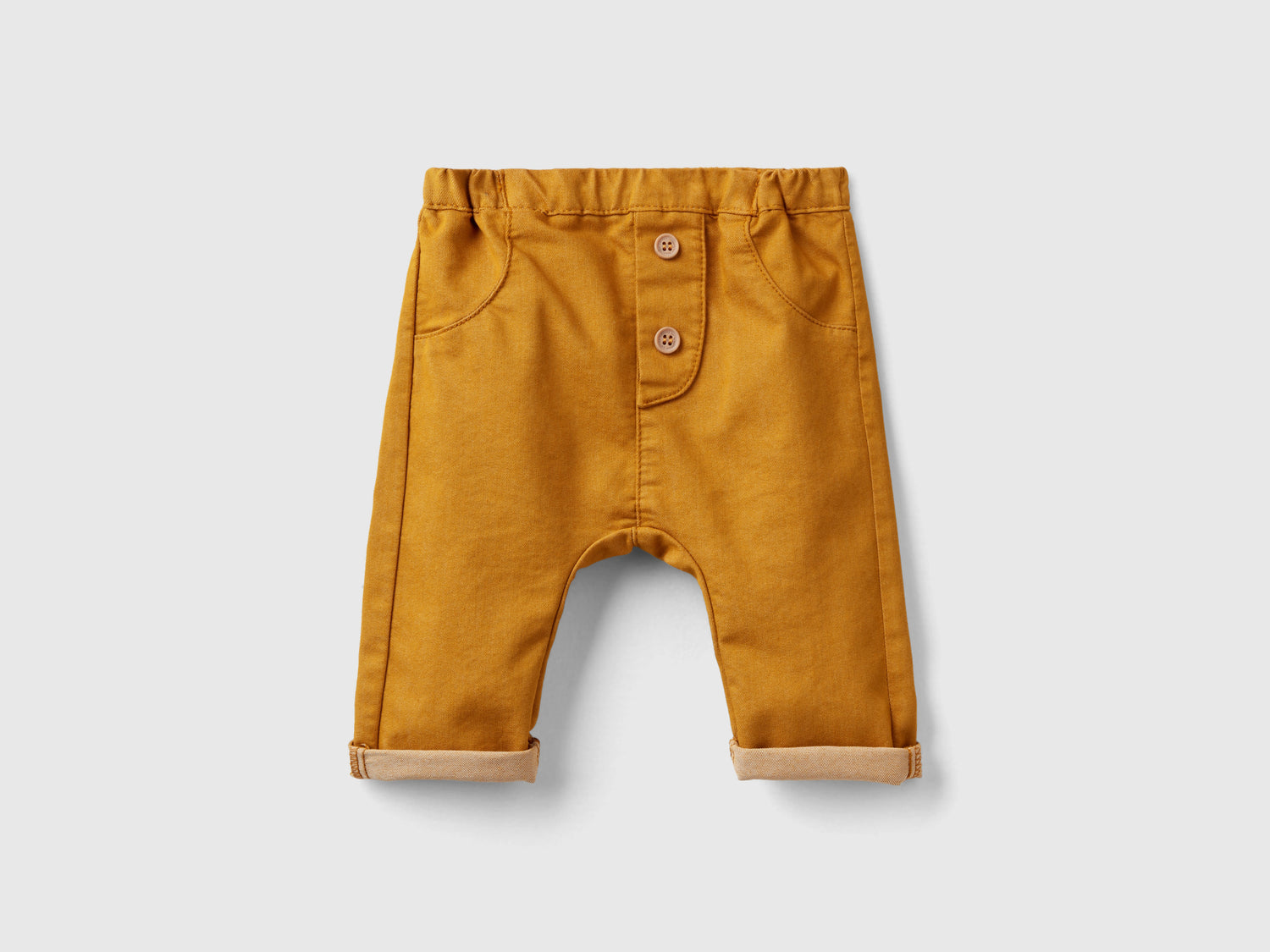 Pantaloni in misto cotone stretch da neonato senape | Benetton Outlet