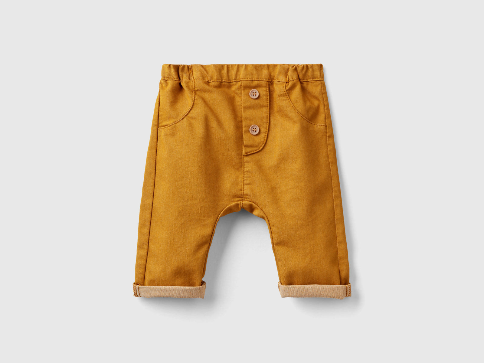 Pantaloni in misto cotone stretch da neonato senape | Benetton Outlet