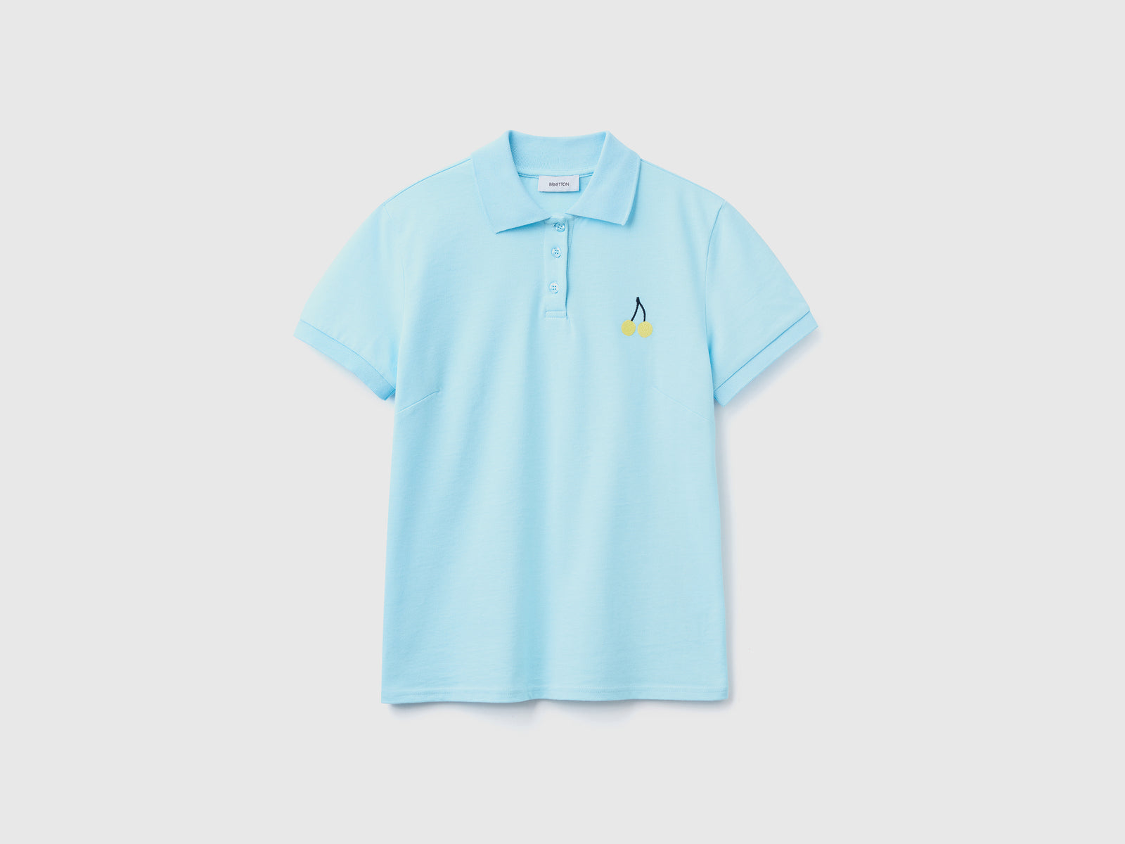 Polo con ricamo frutta da donna azzurro | Benetton Outlet