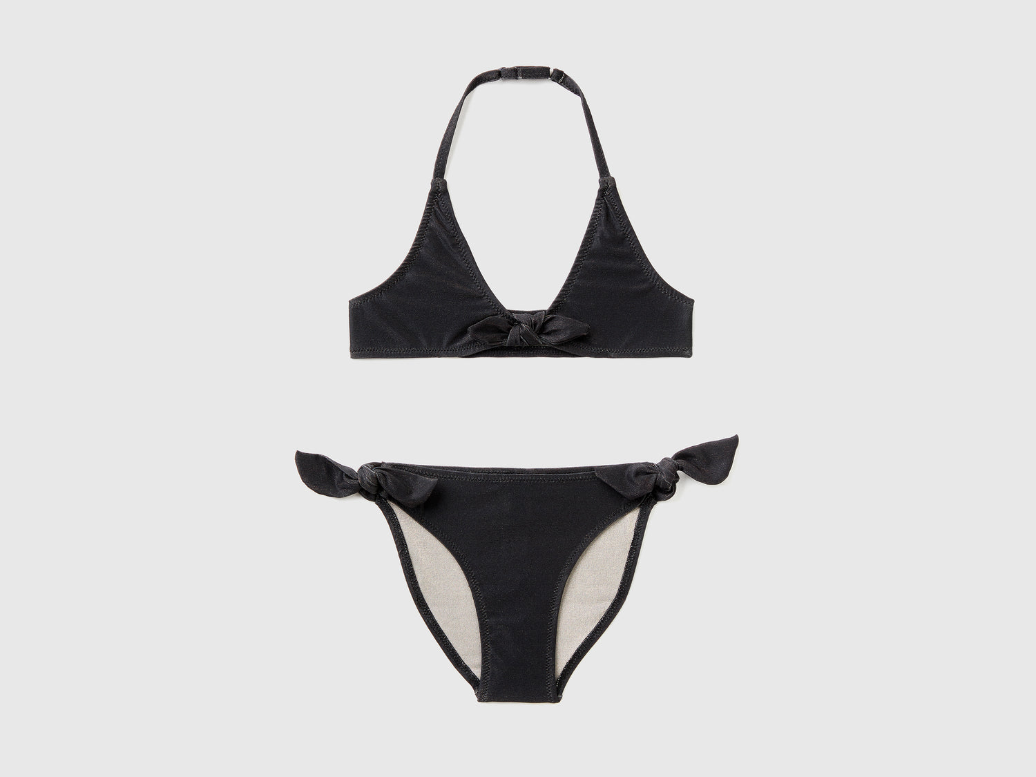 Costume bikini in tessuto elasticizzato con lurex da bambina nero | Benetton Outlet