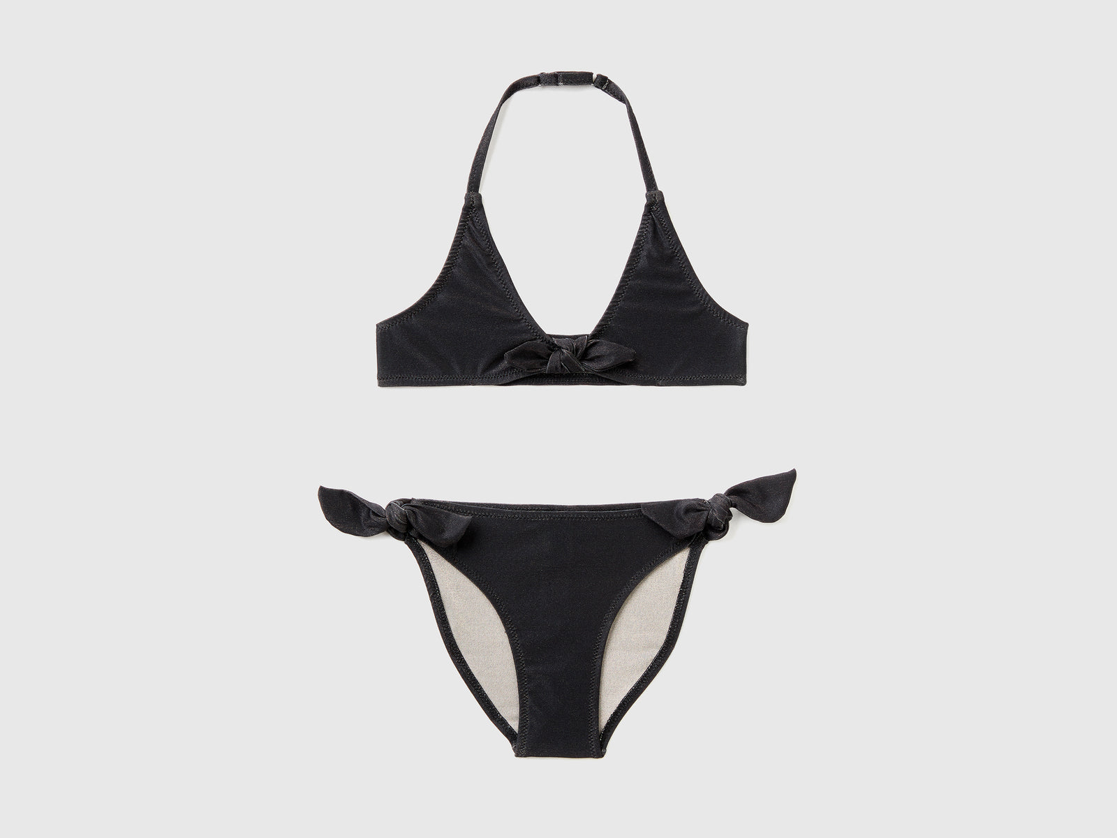 Costume bikini in tessuto elasticizzato con lurex da bambina nero | Benetton Outlet