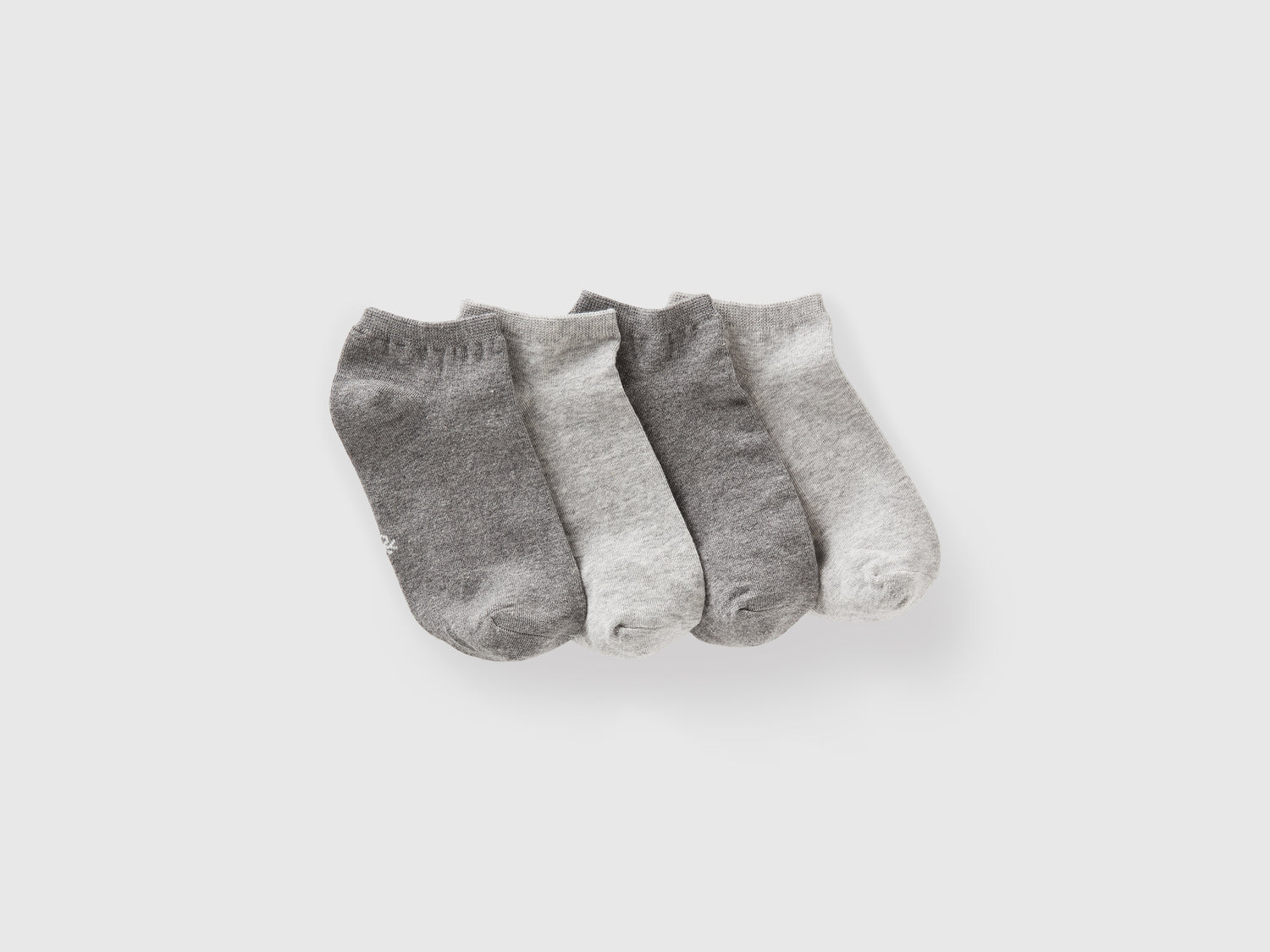 Quattro paia di calzini corti da bambino grigio | Benetton Outlet