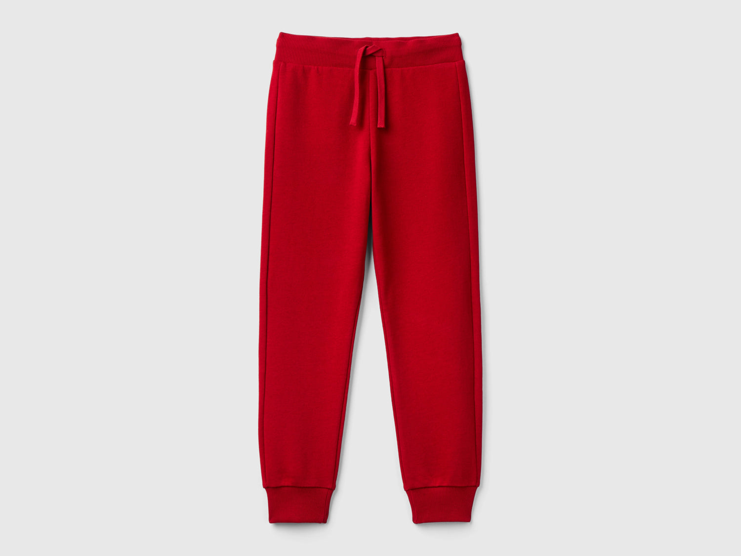 Pantaloni sportivi con coulisse da bambino rosso | Benetton Outlet