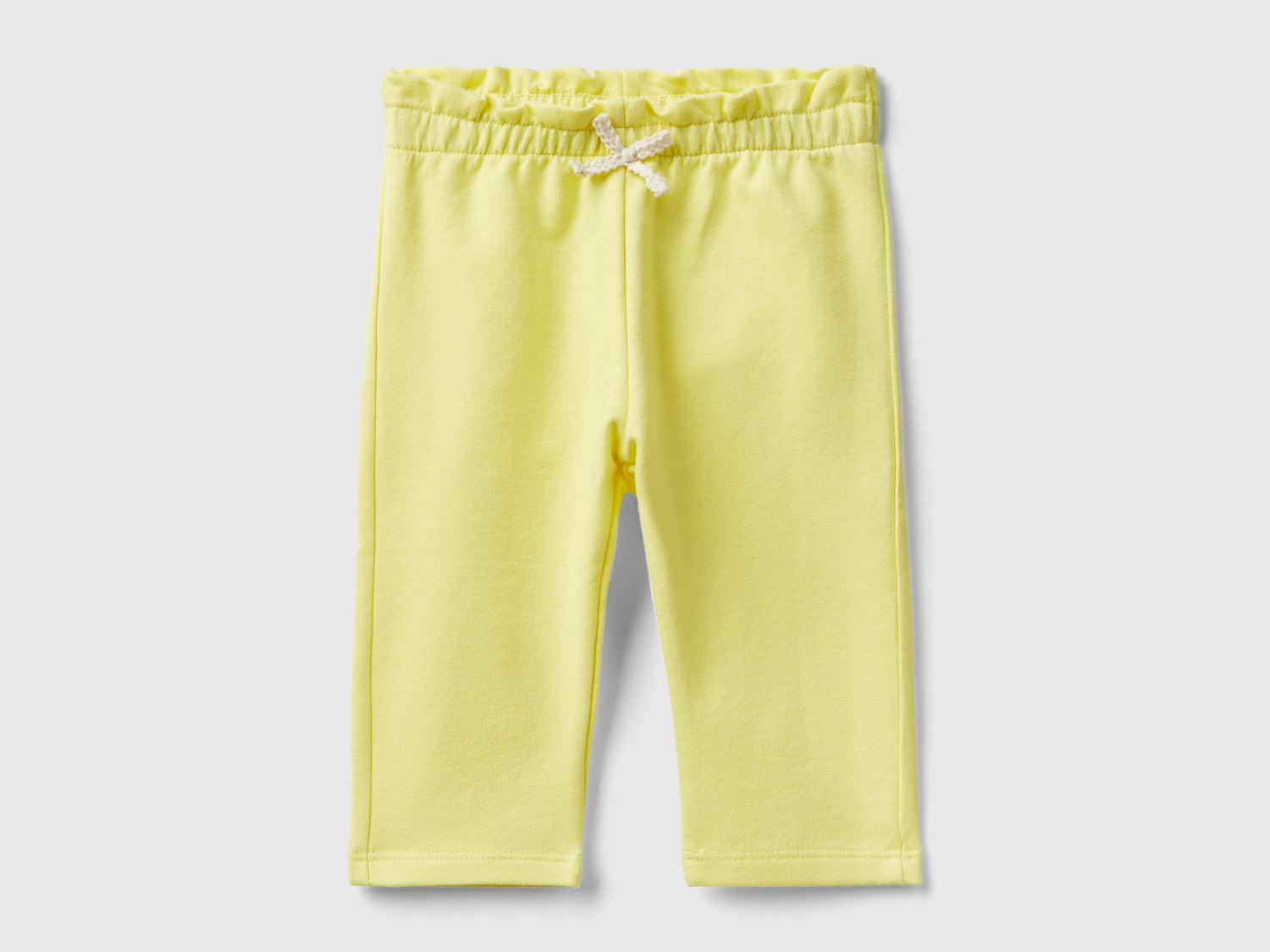 Pantaloni in felpa di cotone bio stretch da neonato giallo | Benetton Outlet