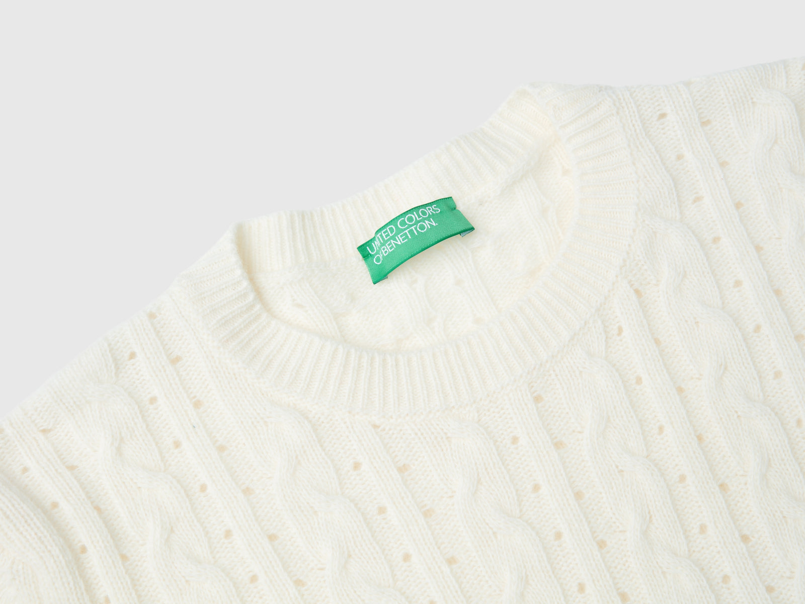 Maglia cropped con trecce e trafori da donna bianco panna 3 | Benetton Outlet