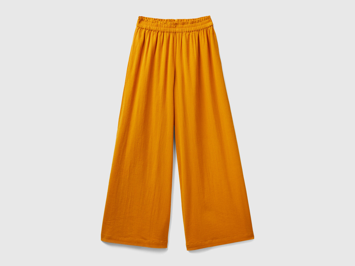 Pantaloni con gamba ampia da donna senape | Benetton Outlet