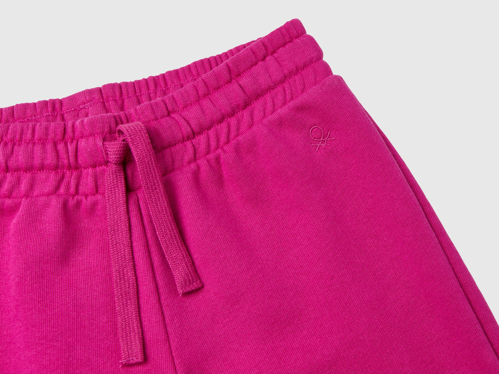 Pantaloni in felpa con logo da bambina fucsia 3 | Benetton Outlet