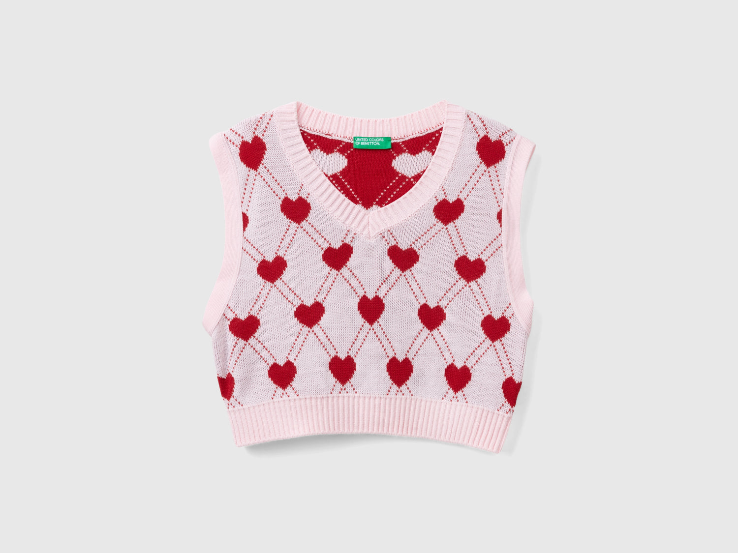 Gilet cropped con motivo cuori da bambina rosa | Benetton Outlet