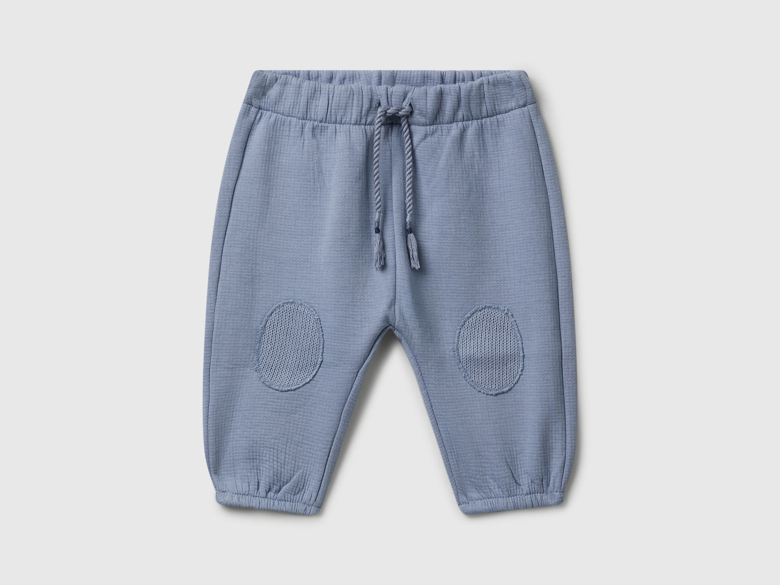 Pantaloni in cotone con patch da neonato celeste | Benetton Outlet
