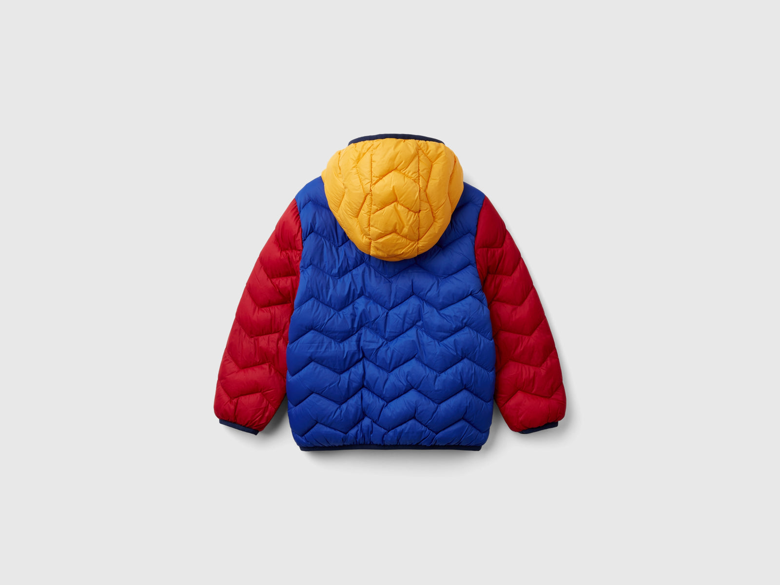 Giubbotto imbottito con cappuccio da bimbo multi-color 2 | Benetton Outlet