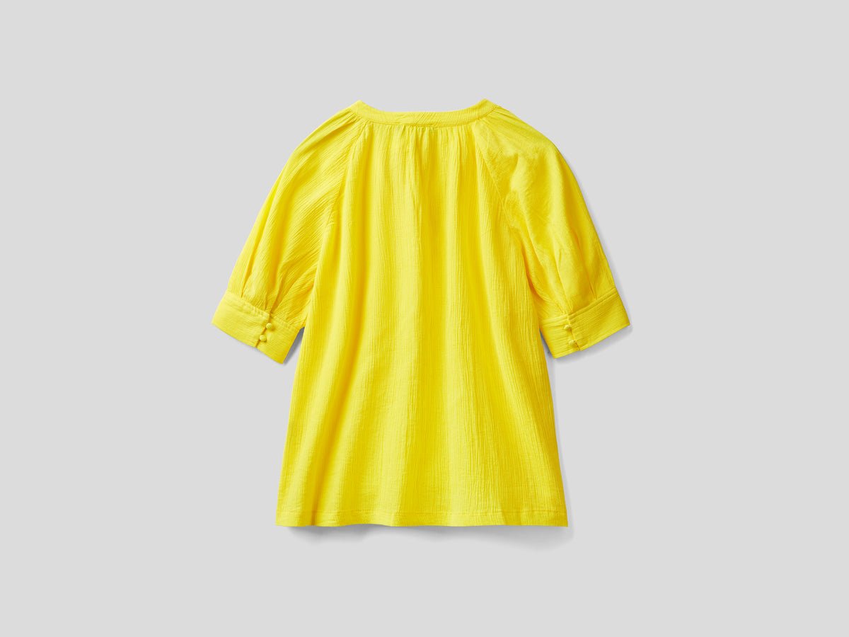 Blusa con fiocco al collo