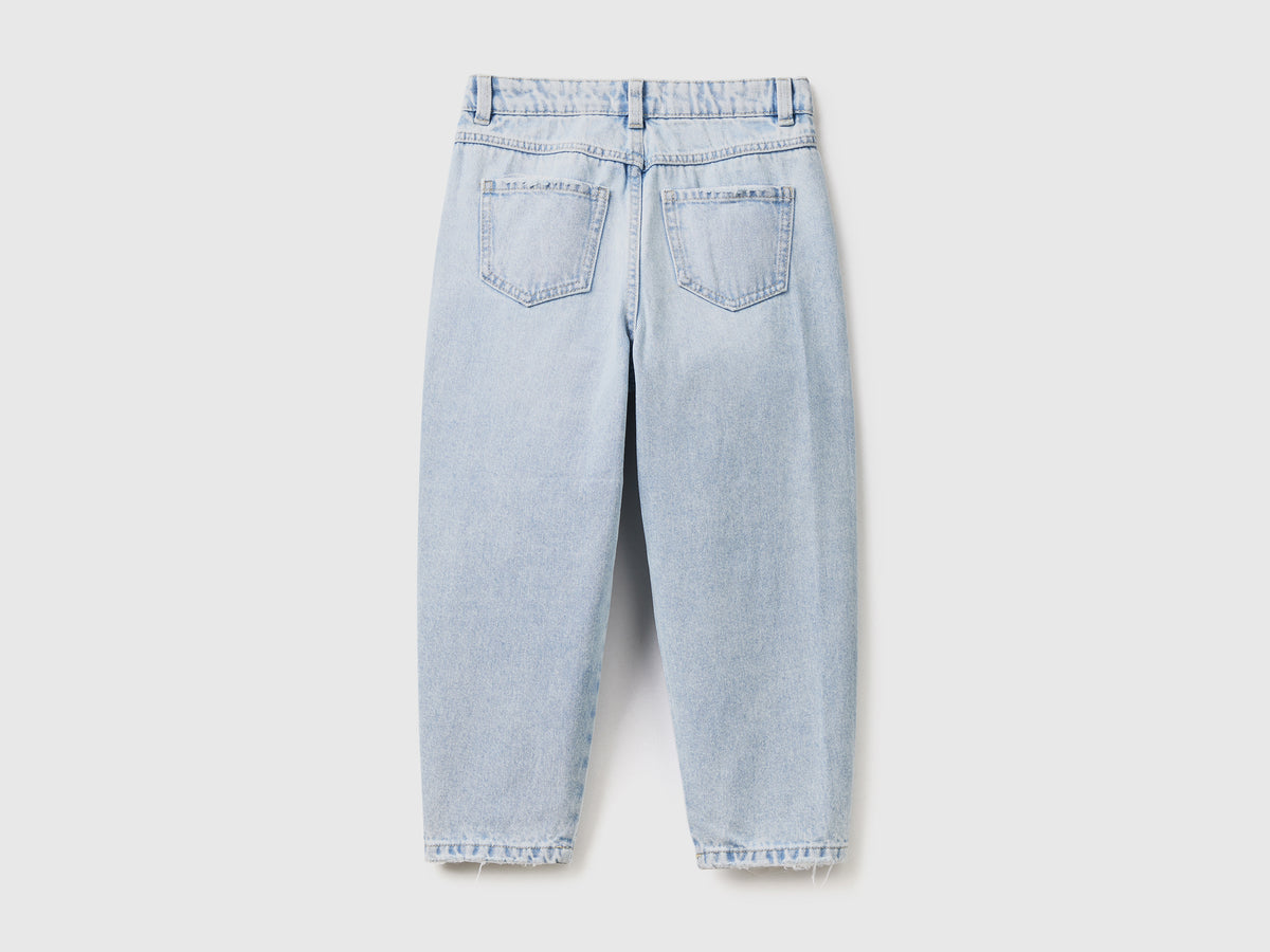 Pantaloni lunghi baggy fit in denim di puro cotone con rotture