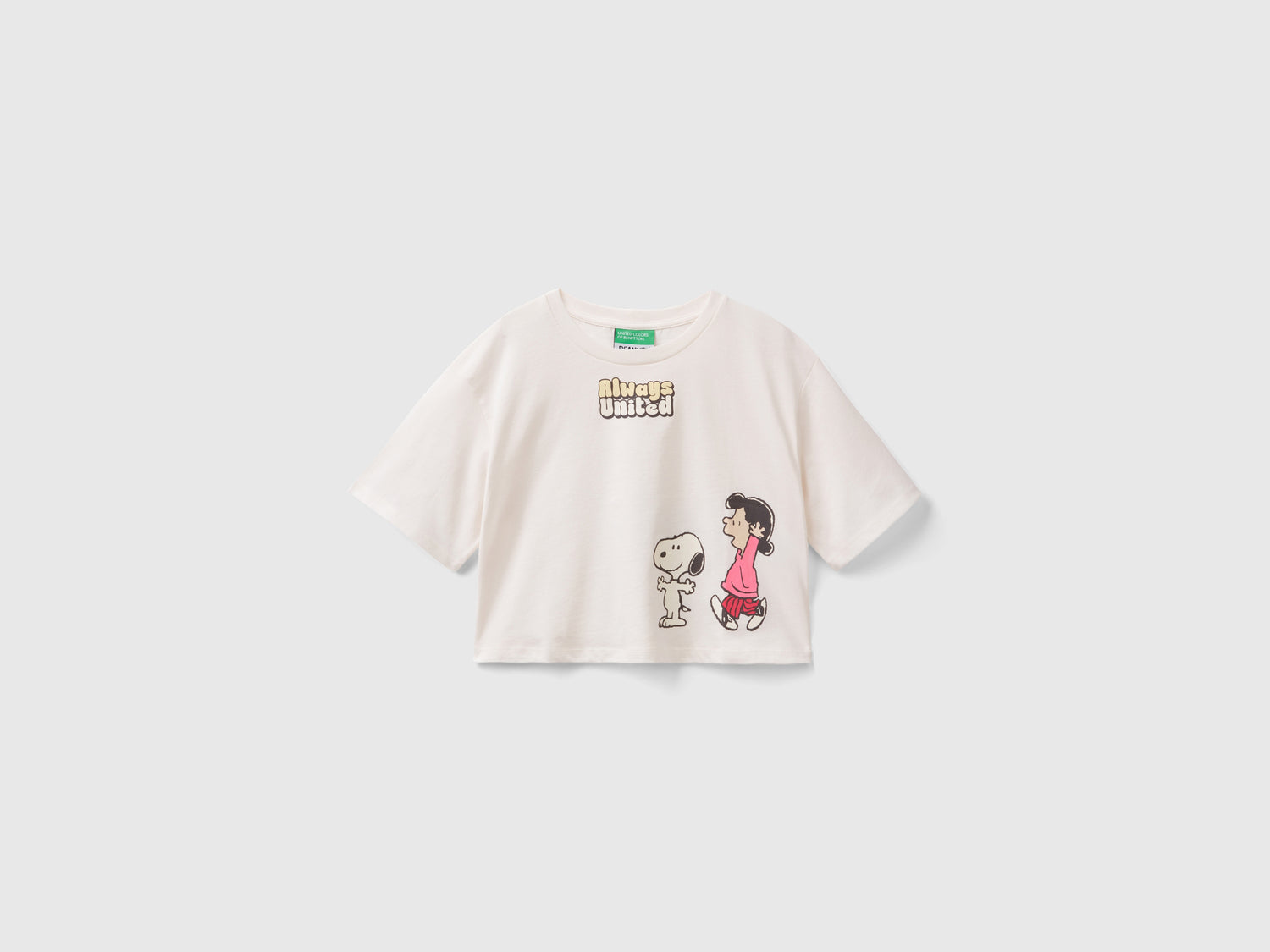 T-shirt cropped ©Peanuts da bambina bianco panna | Benetton Outlet