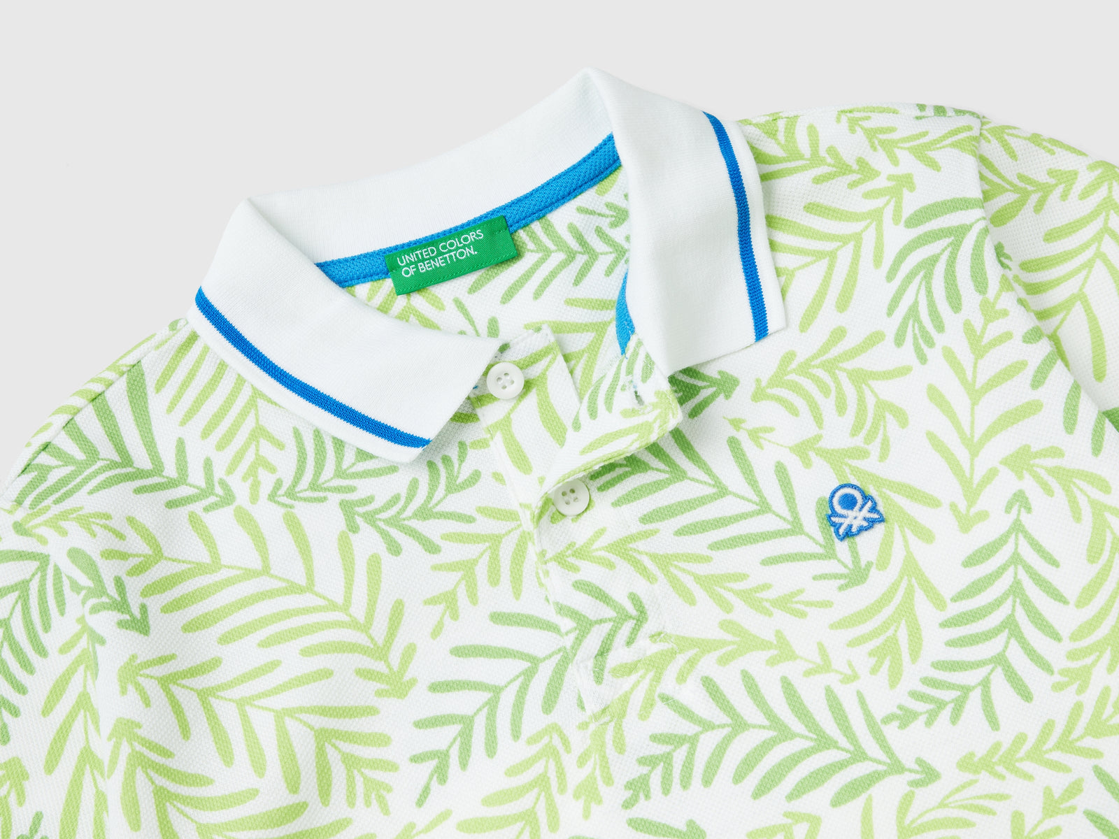 Polo con stampa tropicale da bambino bianco 2 | Benetton Outlet