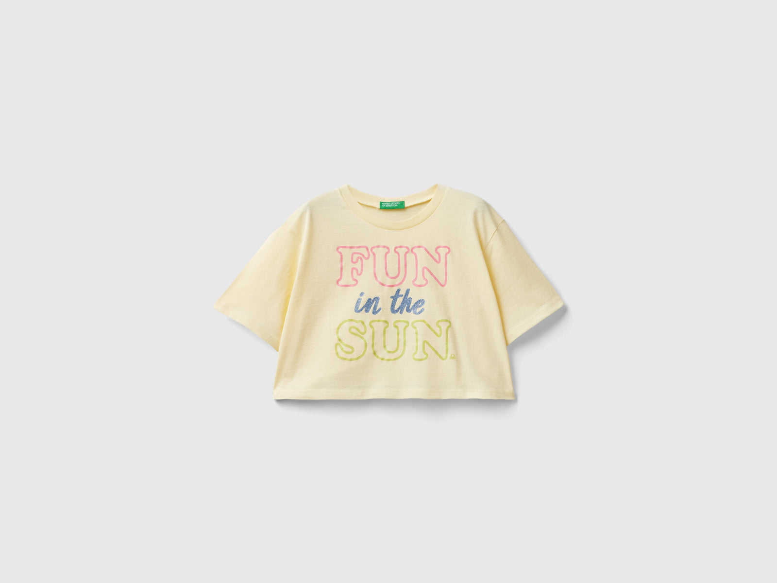 Maglietta con stampa glitter da bambina bianco panna | Benetton Outlet