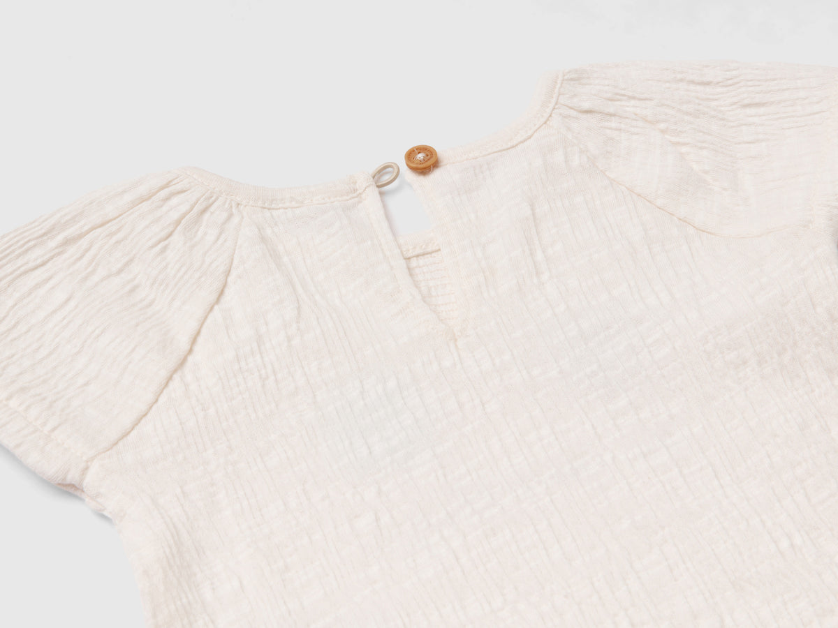 T-shirt con stampa e rouches