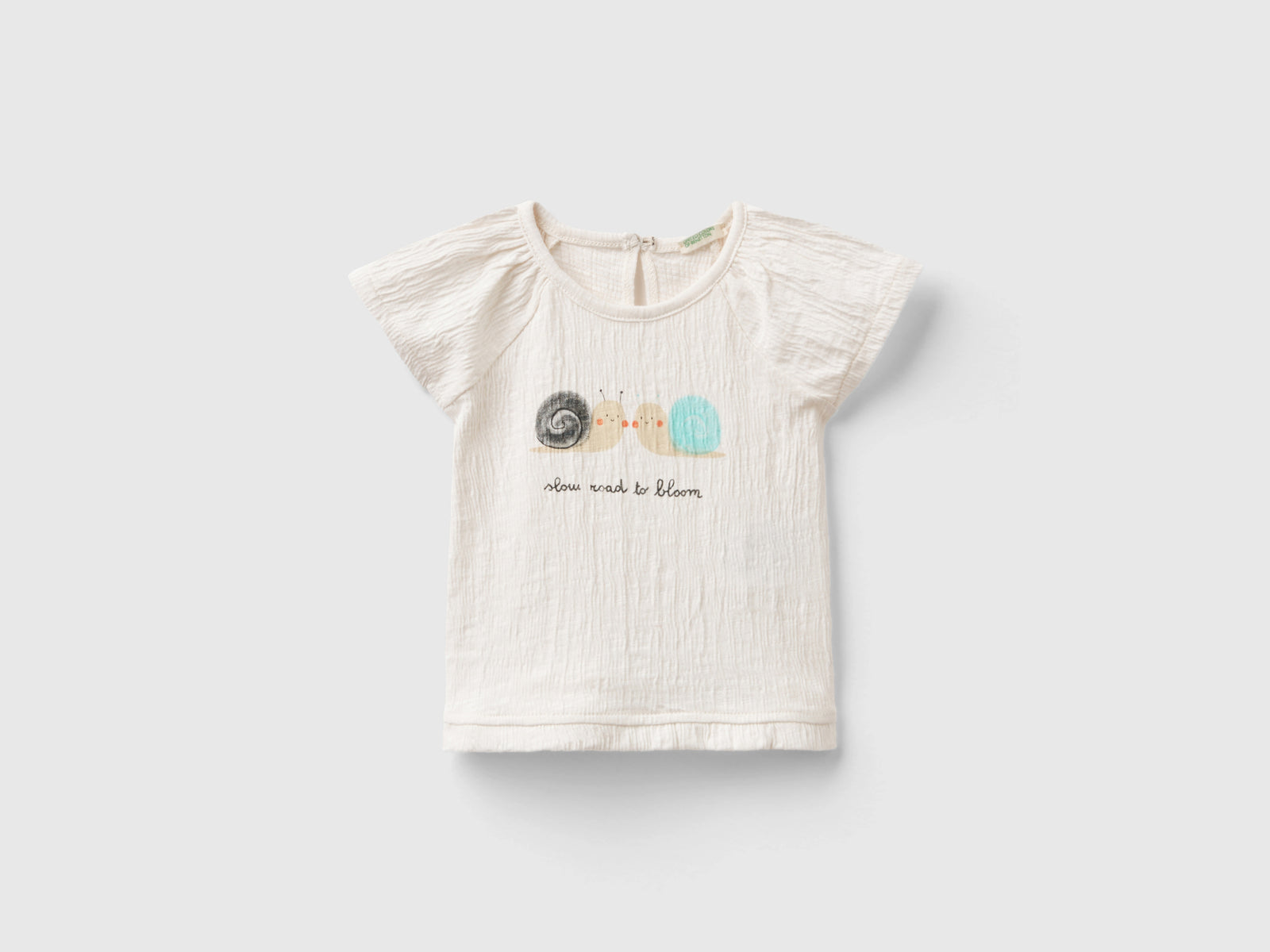 T-shirt con stampa e rouches da neonato bianco panna | Benetton Outlet