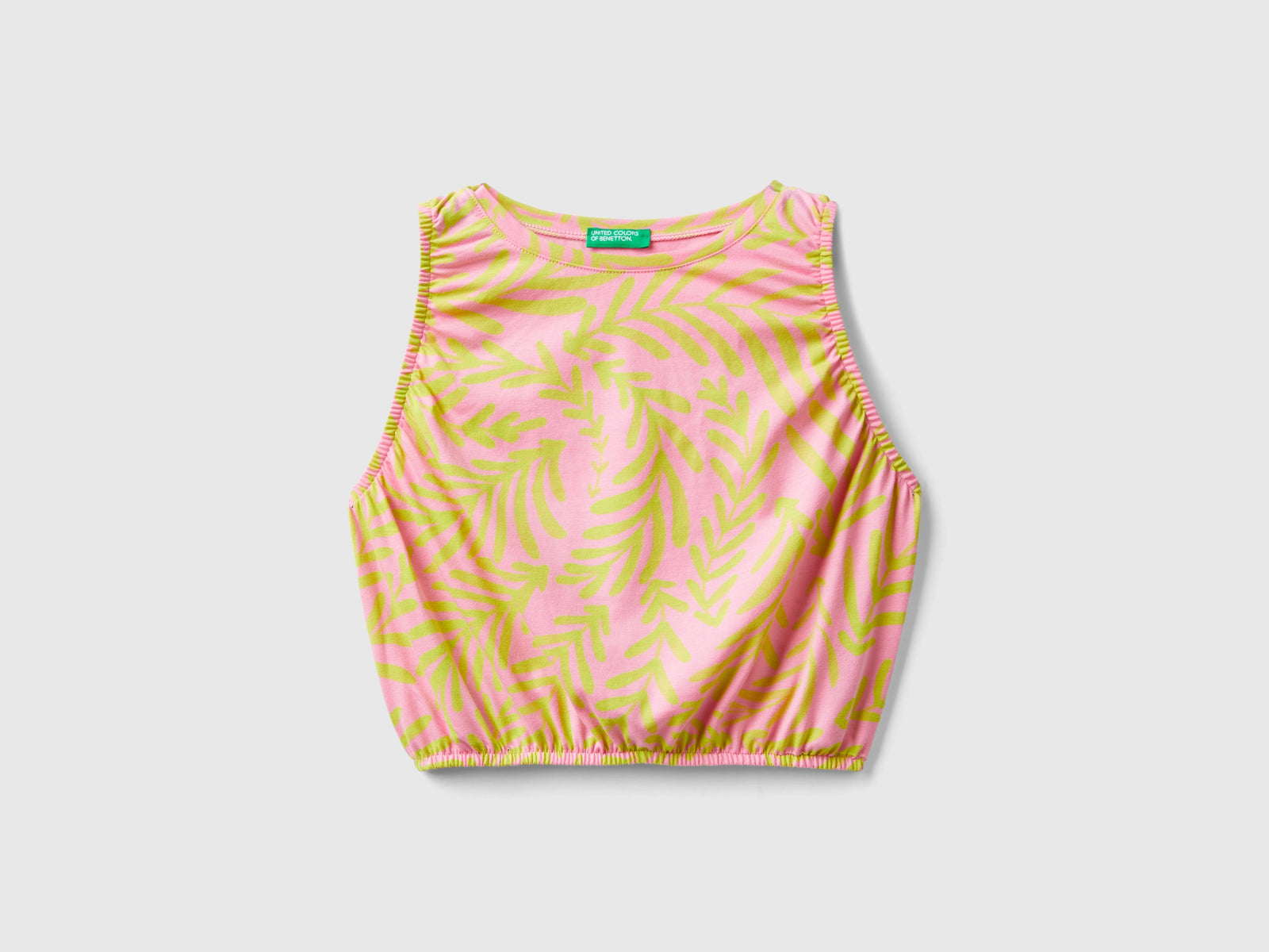 Top rosa chiaro con stampa tropicale da bambina rosa tenue | Benetton Outlet