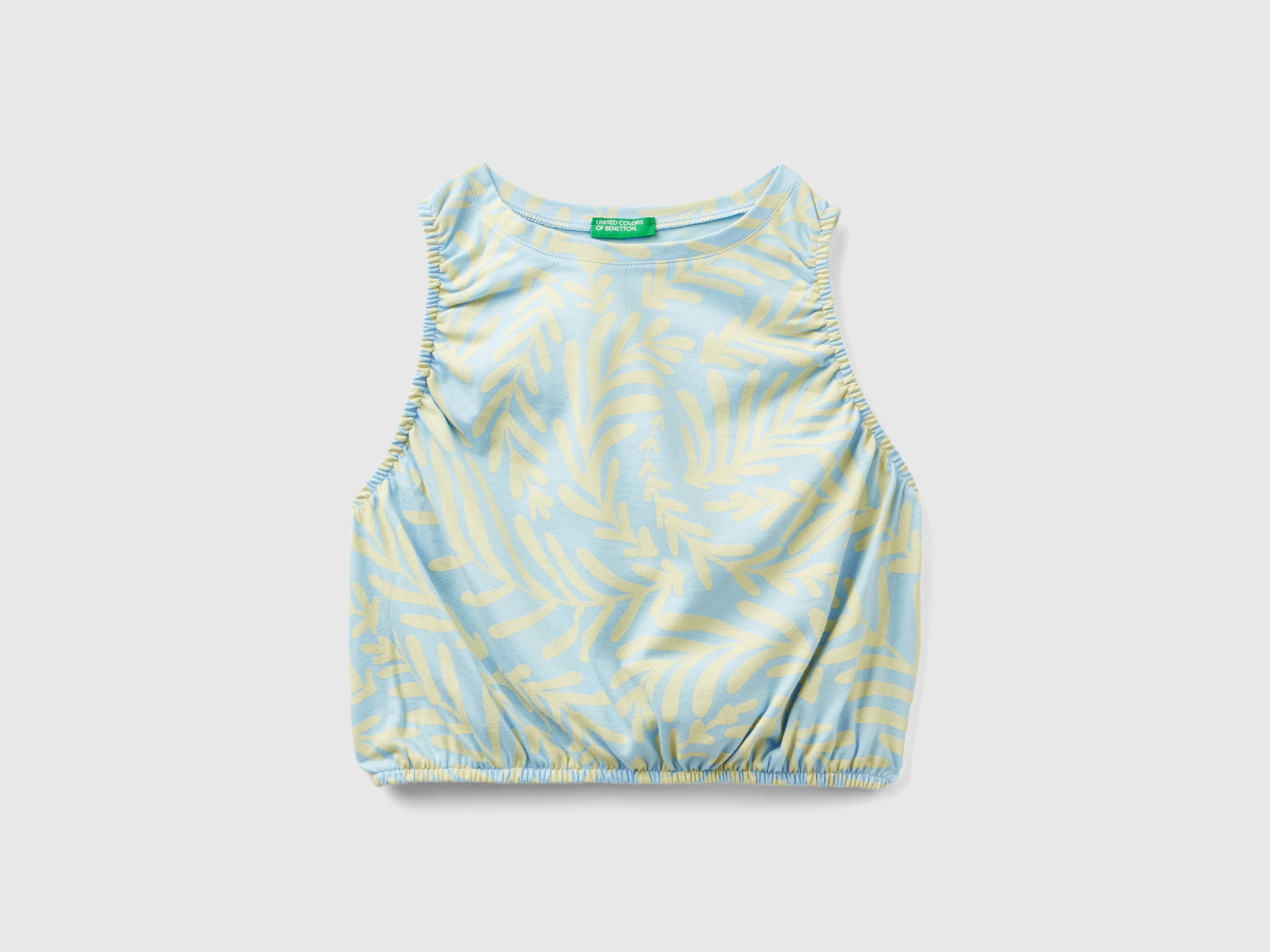 Top con stampa tropicale da bambina celeste | Benetton Outlet