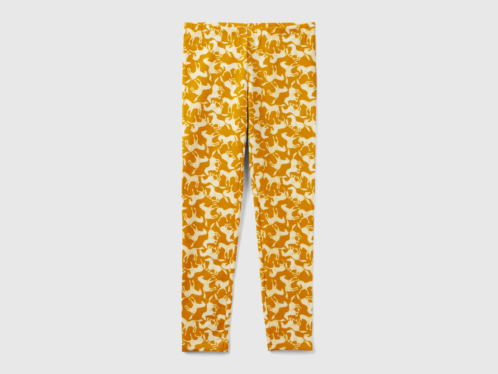 Leggings con stampa cavalli da bambina senape | Benetton Outlet