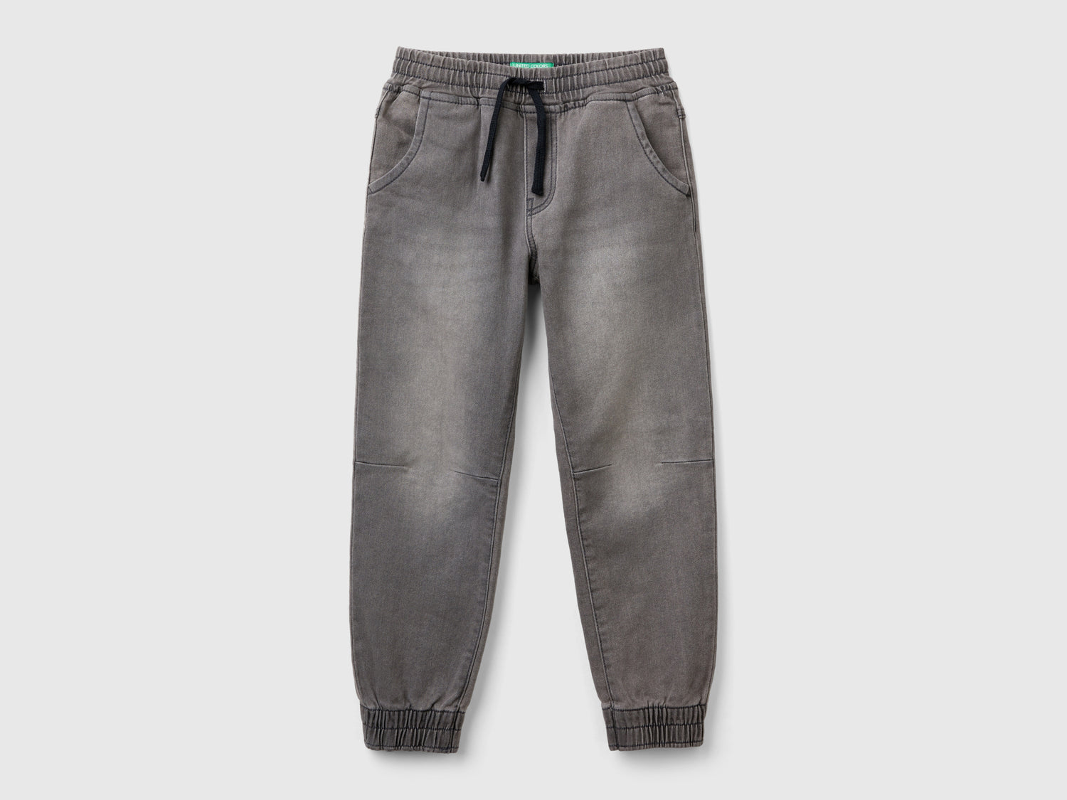 Joggers in denim da bambino nero | Benetton Outlet