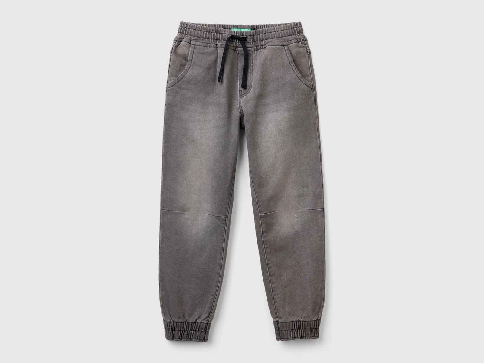 Joggers in denim da bambino nero | Benetton Outlet