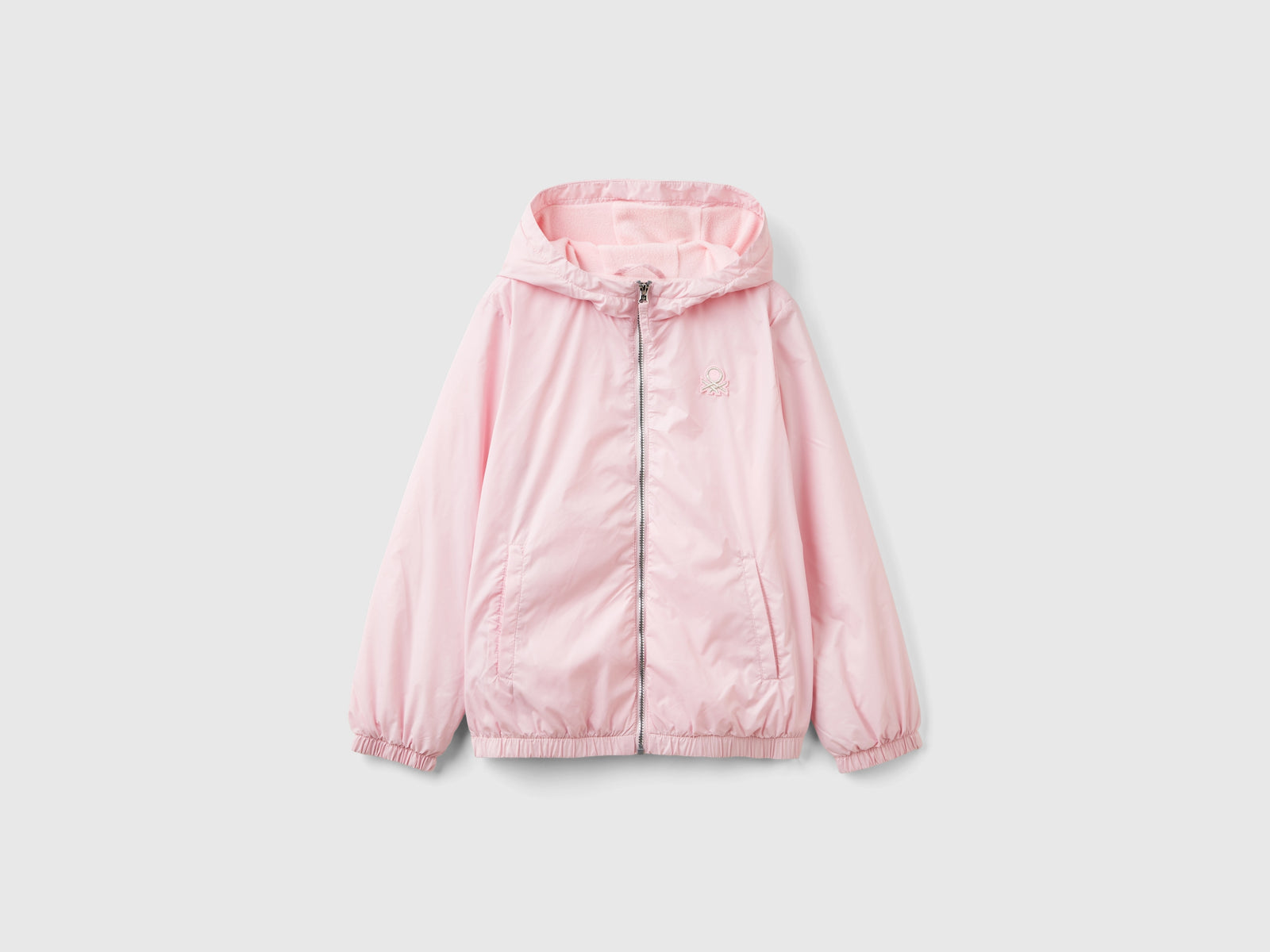 Giubbino lucido con zip e cappuccio da bambina rosa | Benetton Outlet
