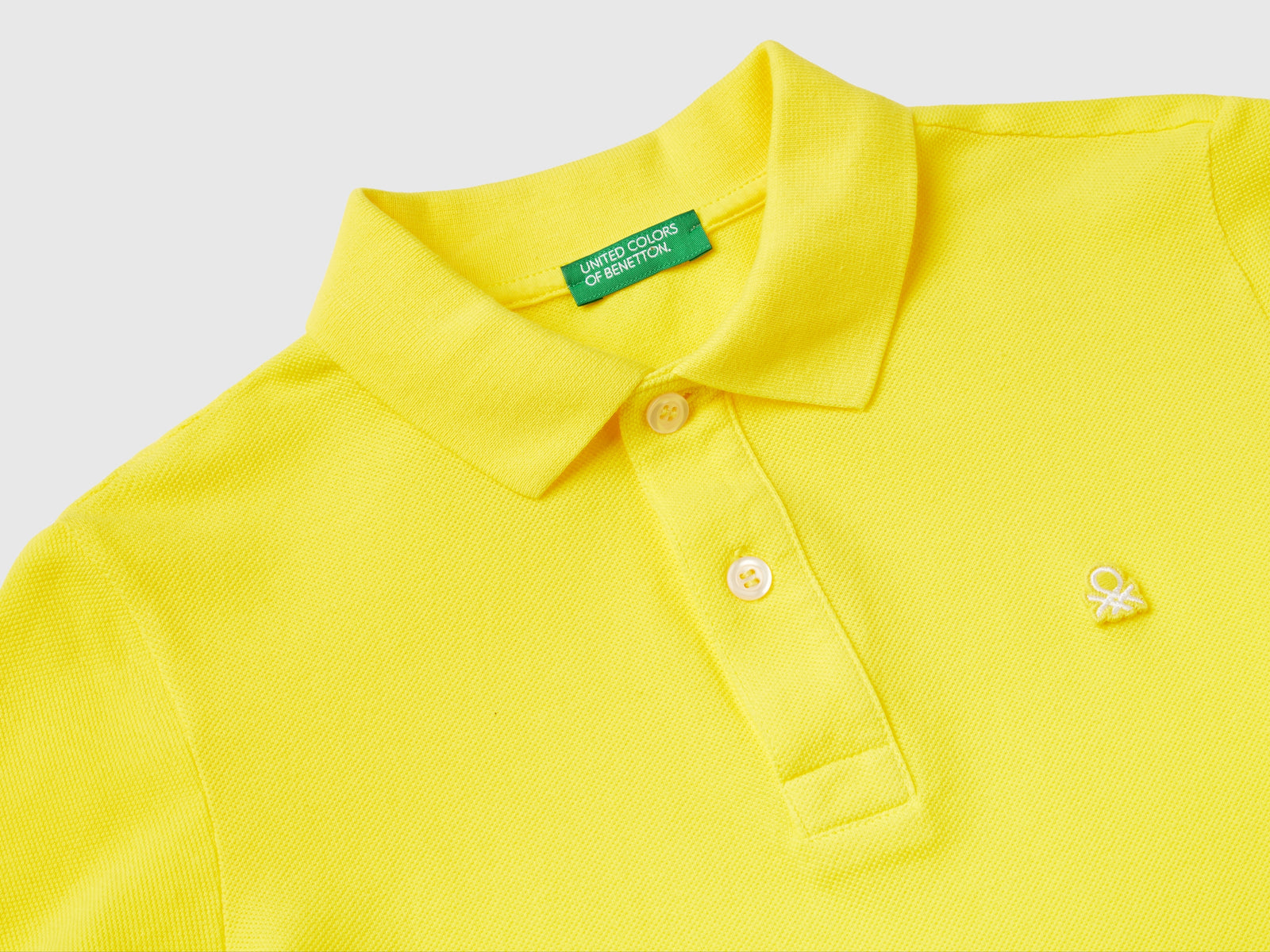 Polo slim fit 100% cotone bio da bambino giallo 2 | Benetton Outlet