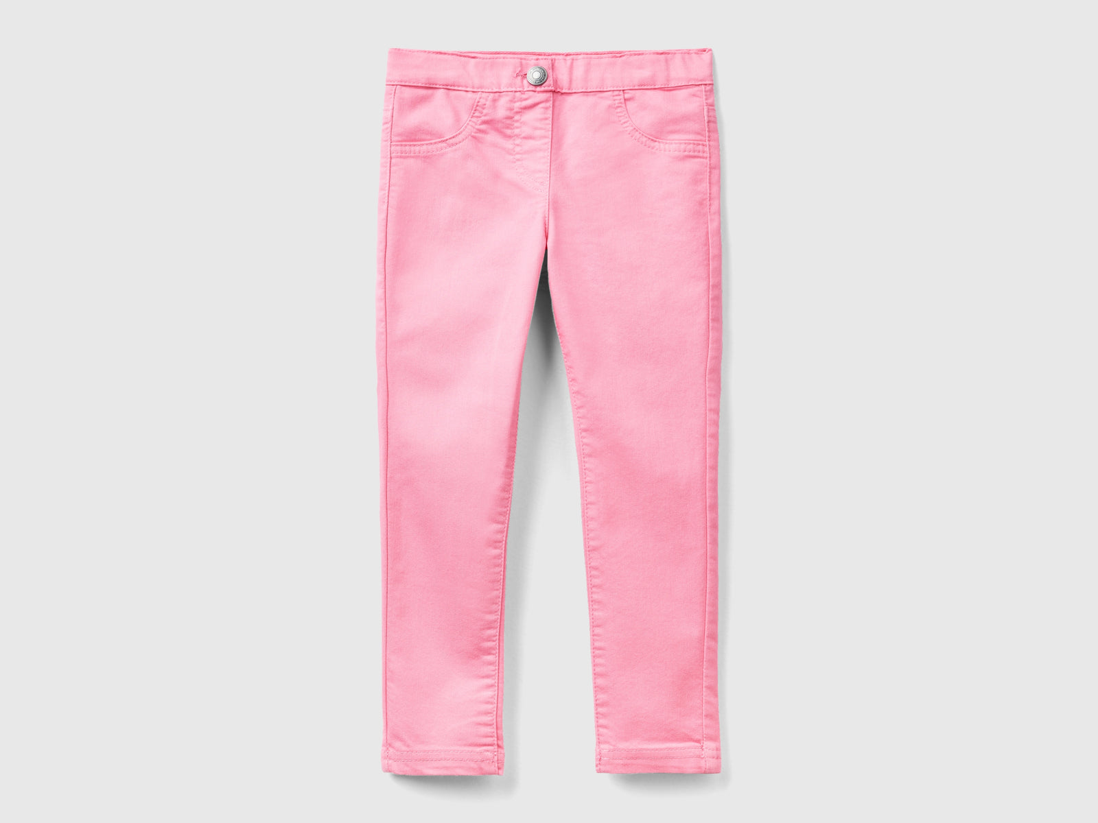 Jeggings in misto cotone stretch da bimba rosa | Benetton Outlet
