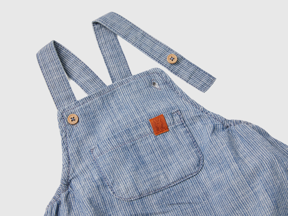 Salopette a righe in chambray