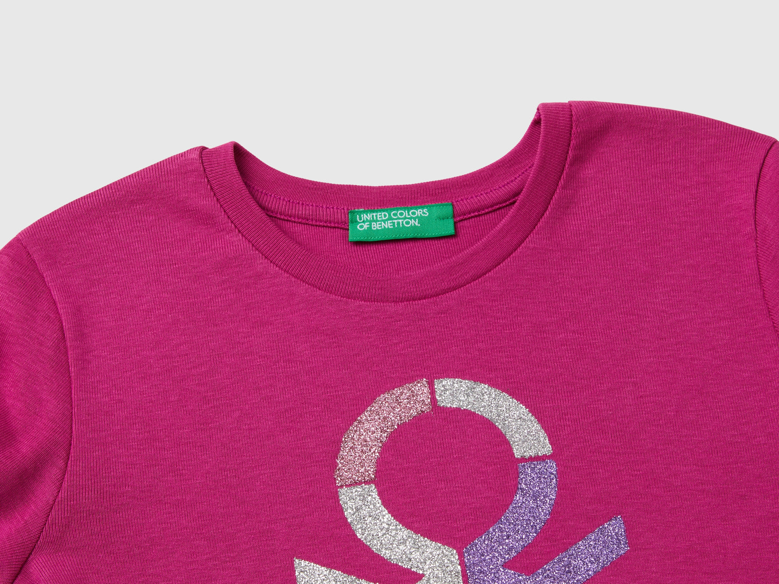 T-shirt manica lunga con stampa glitter da bambina fucsia 3 | Benetton Outlet