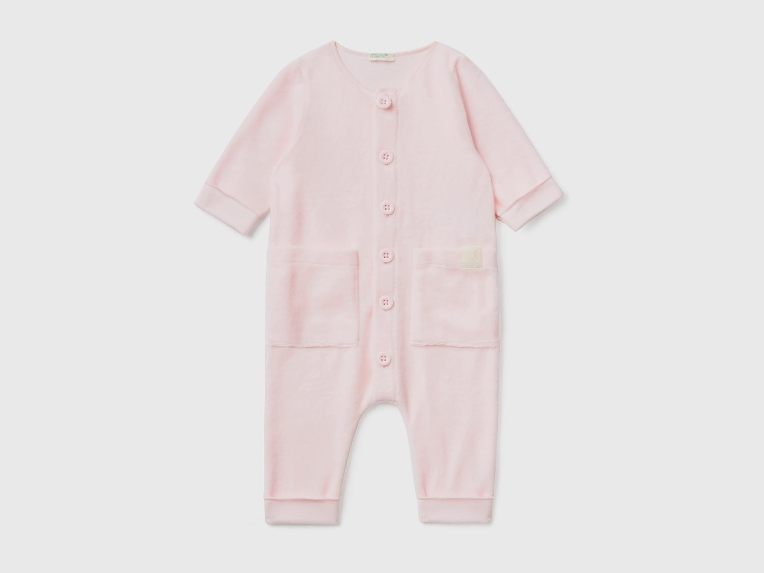 Tutina in ciniglia con taschini da neonato rosa tenue | Benetton Outlet