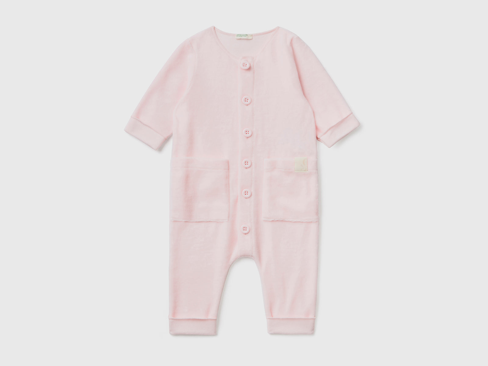 Tutina in ciniglia con taschini da neonato rosa tenue | Benetton Outlet