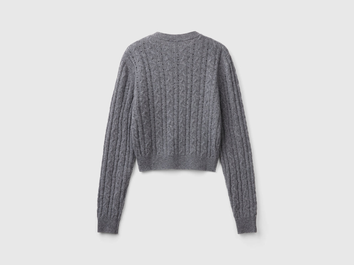 Cropped sweater with cable knit and openwork details