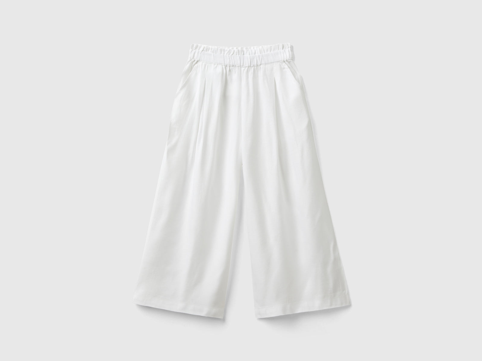 Pantaloni fluidi a palazzo da bimba bianco | Benetton Outlet