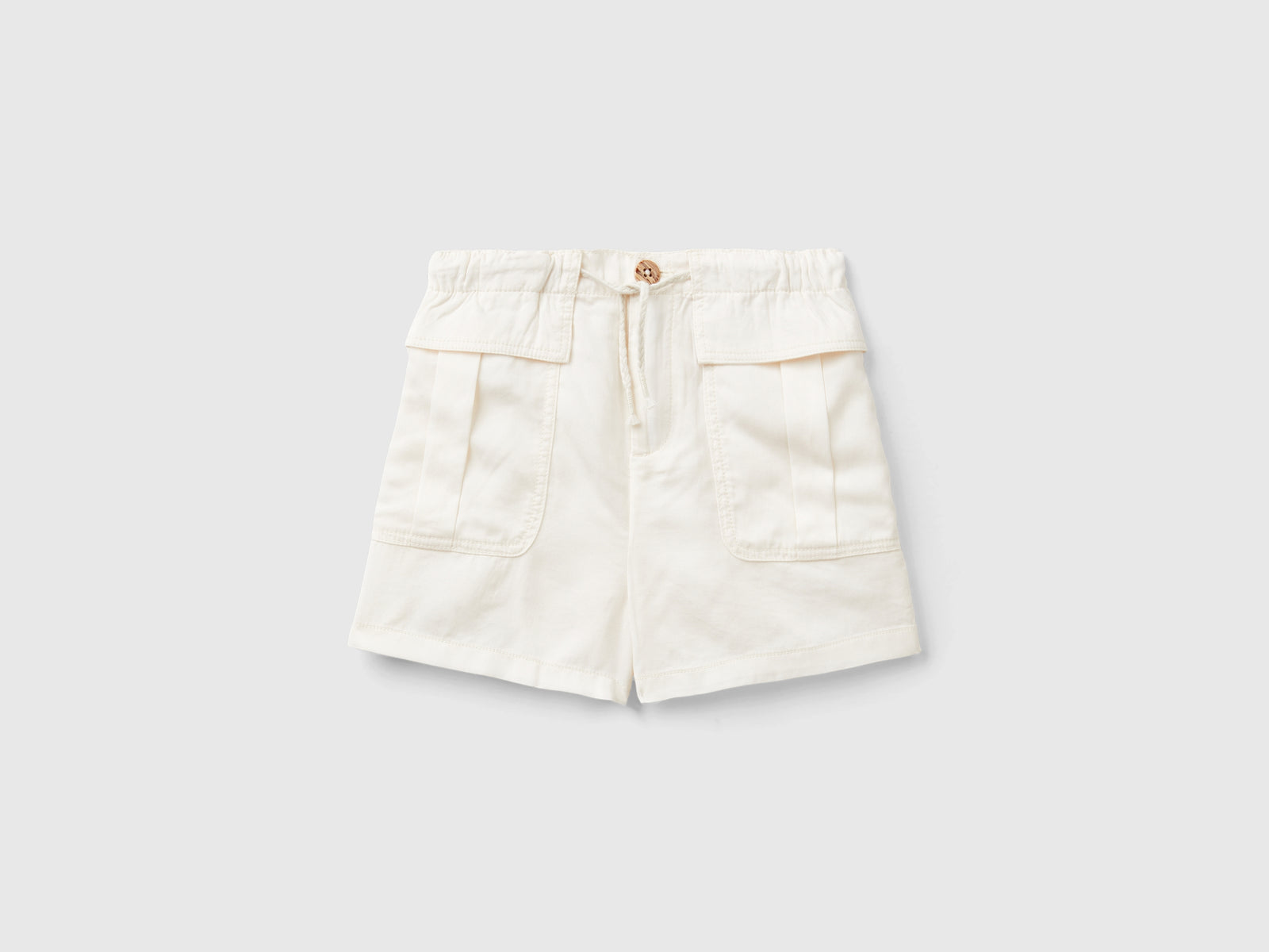 Bermuda fluidi con tasche da bambina bianco panna | Benetton Outlet