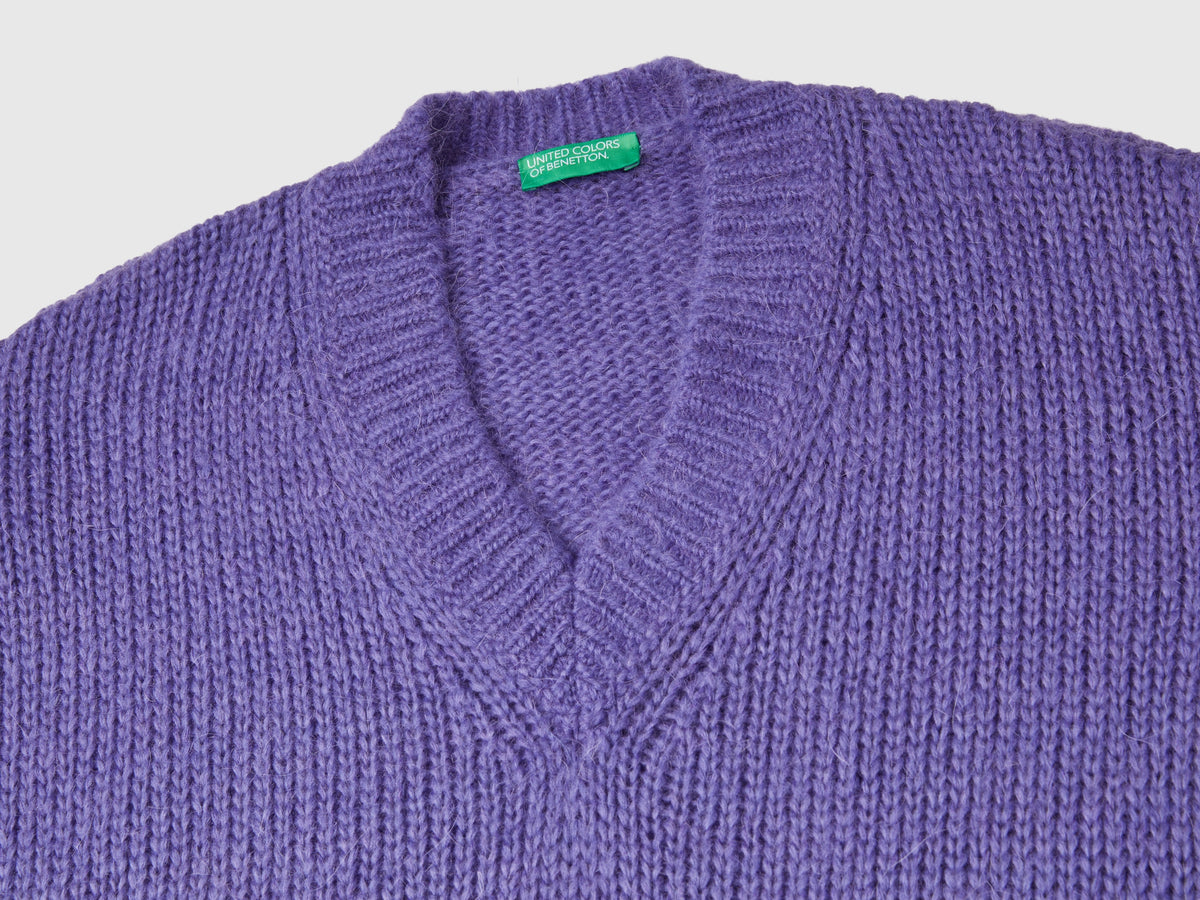 Maglione con manica traforata