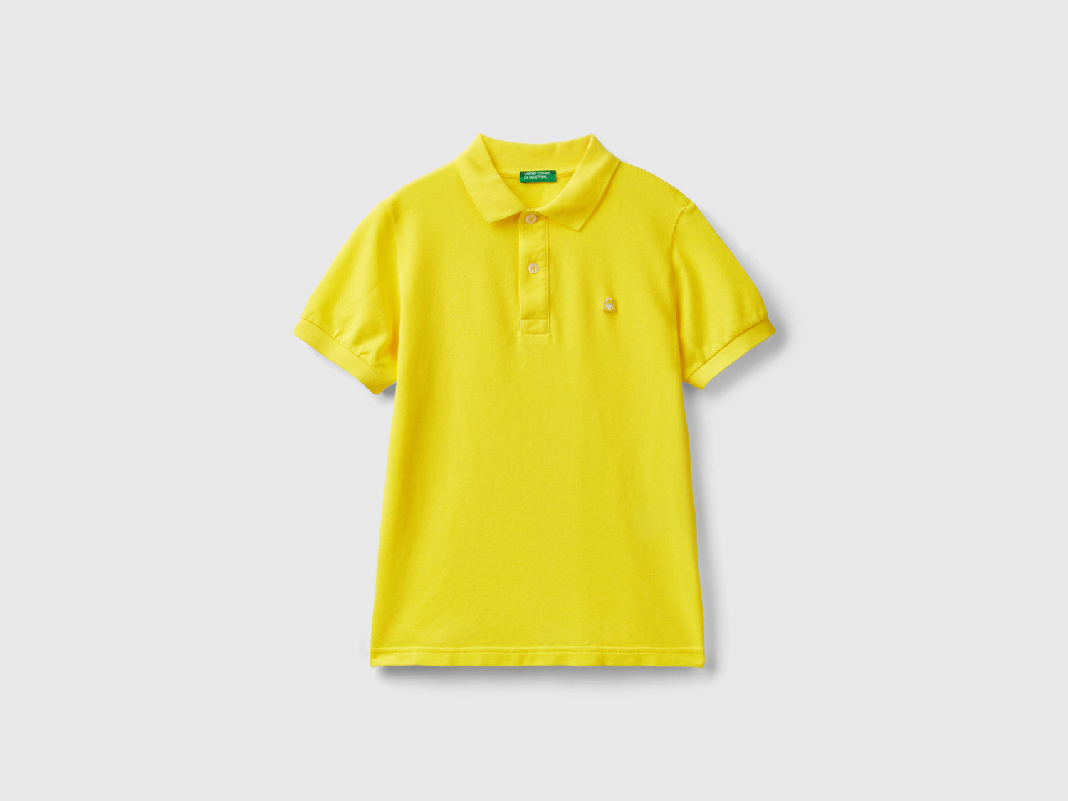 Polo slim fit 100% cotone bio da bambino giallo | Benetton Outlet