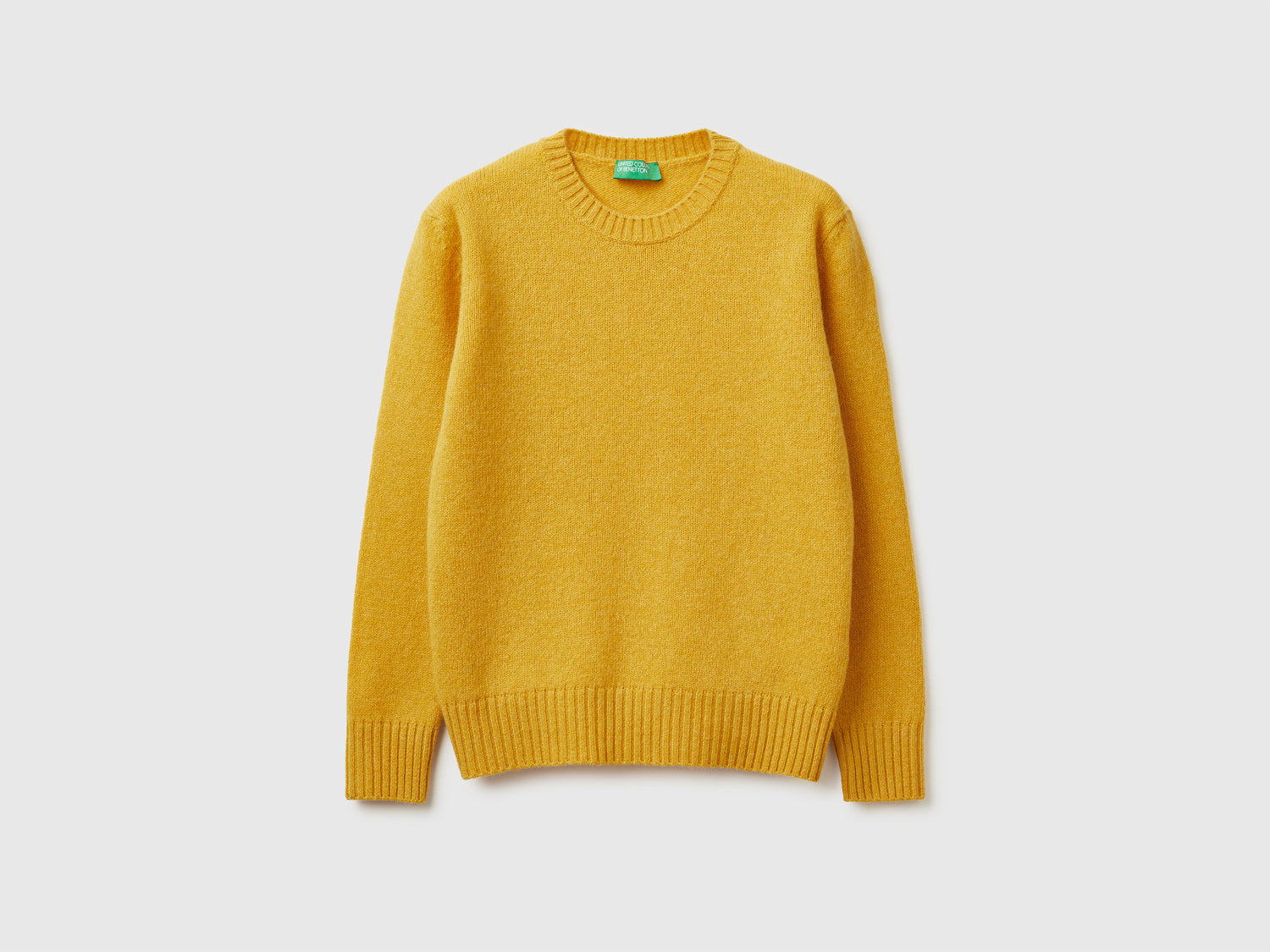 Maglia in pura lana Shetland da donna senape | Benetton Outlet