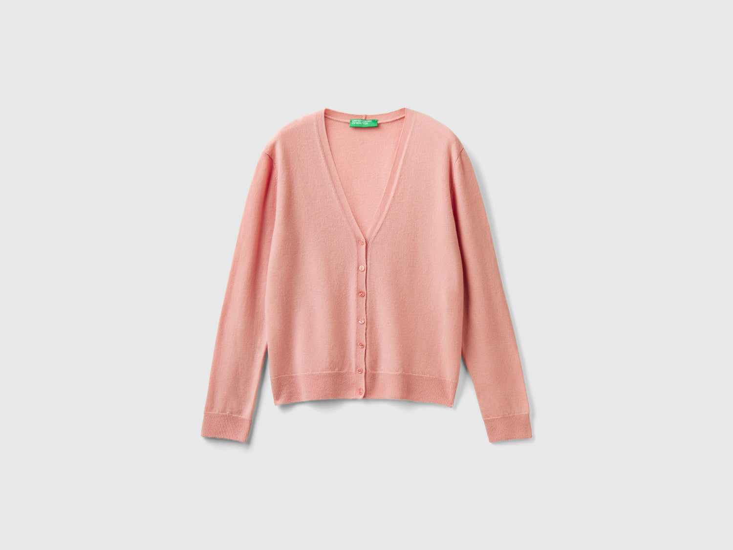 Cardigan scollo a V in pura lana Merino da donna rosa | Benetton Outlet