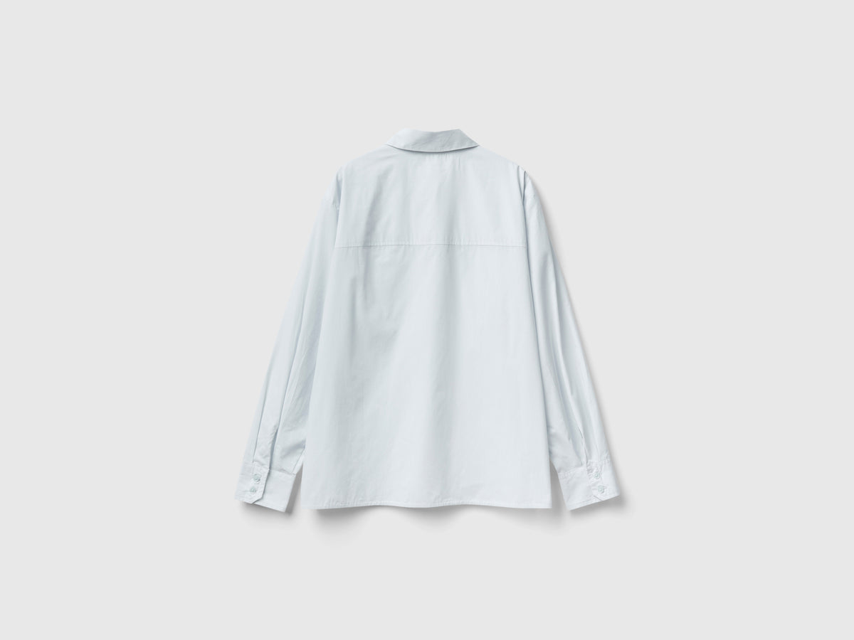 Camicia con tasche e spacchi