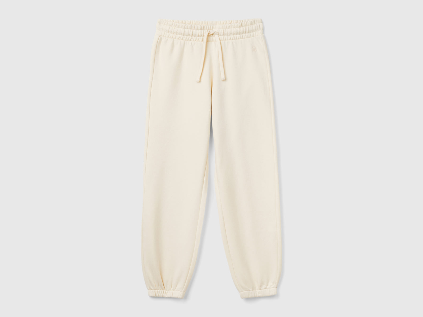 Joggers in felpa con coulisse da bambina bianco panna | Benetton Outlet